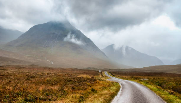 istock Scotland Glencoe landscape with dramatic sky and winding road 171367893