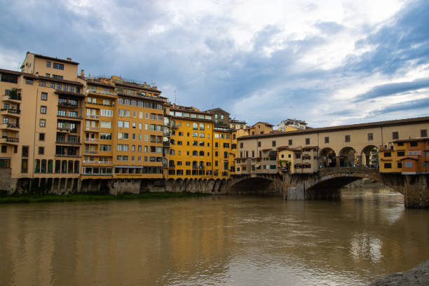 Old buildings and Ponte Vecchio bridge over Arno river in Florence, Italy