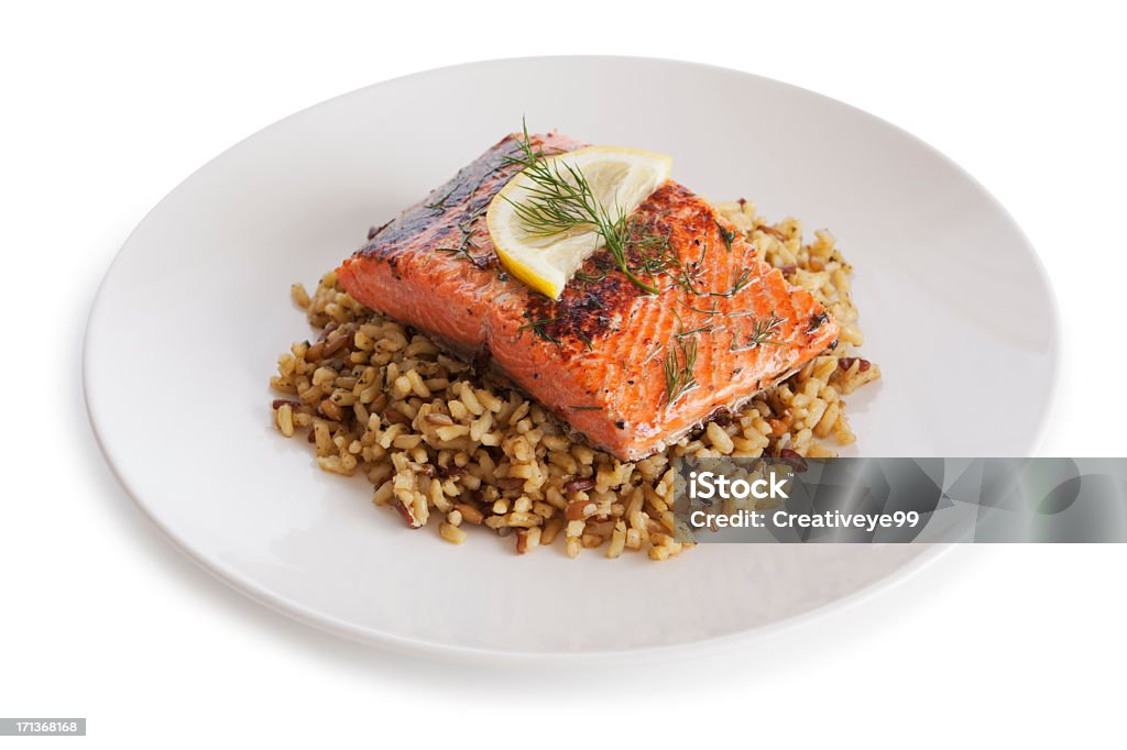 Salmon dish Salmon and brown rice dish on white background Salmon - Seafood Stock Photo