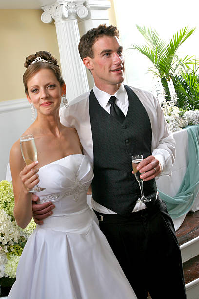 istock Happy Wedding Reception Bride and Groom Newly Weds Toasting Drinks 171369133