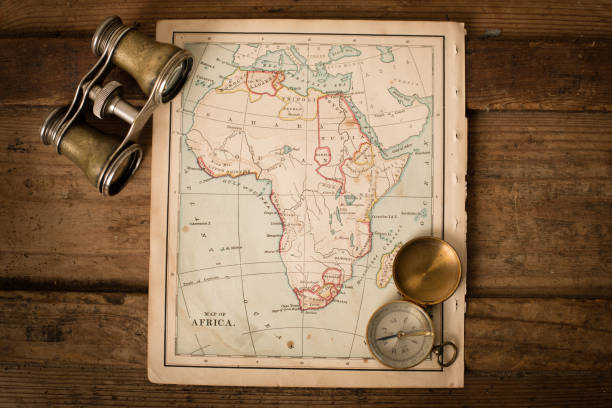 istock Antique 1870 Map of Africa, Binoculars, and Compass on Trunk 171369268