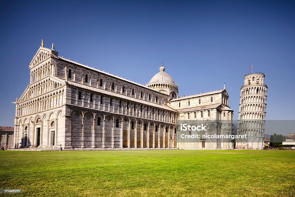 The leaning tower of Pisa and Cathedral, Italy The Piazza del Duomo also known as the Piazza dei Miracoli in Pisa.  Long exposure to blur out people. Pisa Stock Photo
