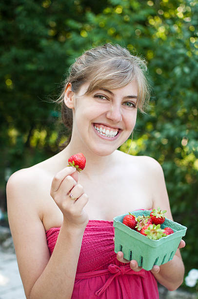 istock Beautiful Woman with Strawberries 171369576