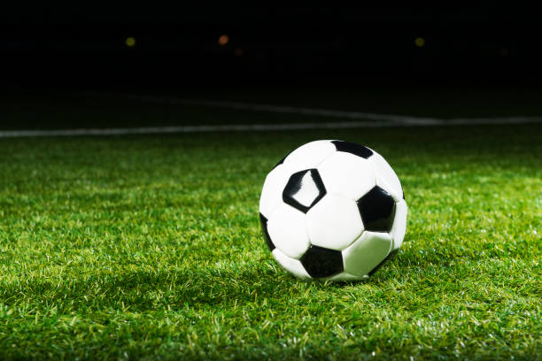 istock Soccer ball in stadium at night 171369590