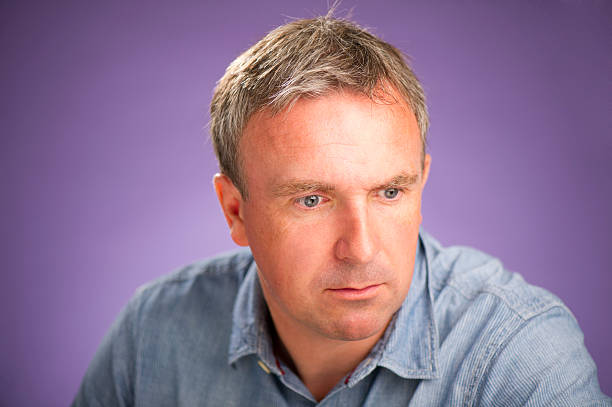 istock mature man looks concerned 171369872
