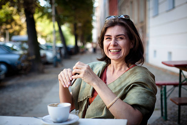 portrait from a beautiful mature woman with a toothy smile