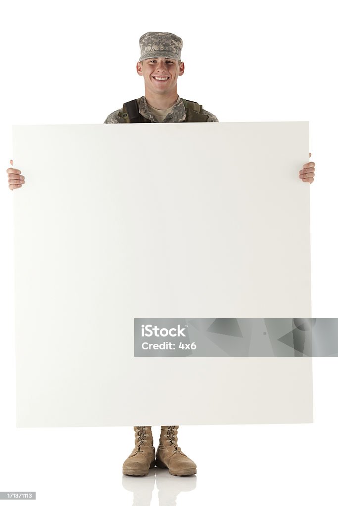 Military man holding a whiteboard and smiling 20-29 Years Stock Photo