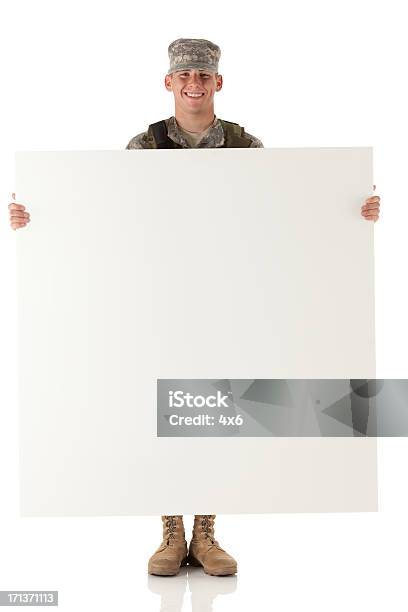 Military Man Holding A Whiteboard And Smiling Stock Photo - Download Image Now - 20-29 Years, Adult, Adults Only