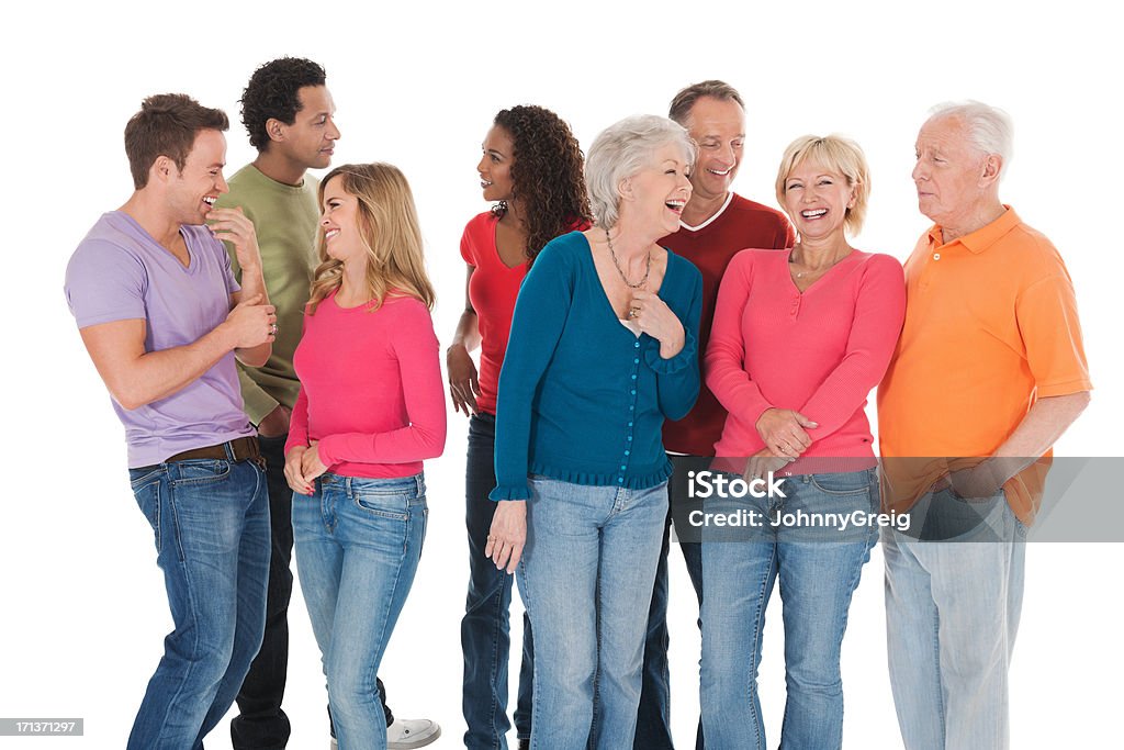Multiracial Group In Casuals - Isolated. Multiracial group in casuals standing together isolated over white background. Horizontal shot. Enjoyment Stock Photo
