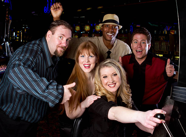istock Excited Group Around Slot Machine 171371427