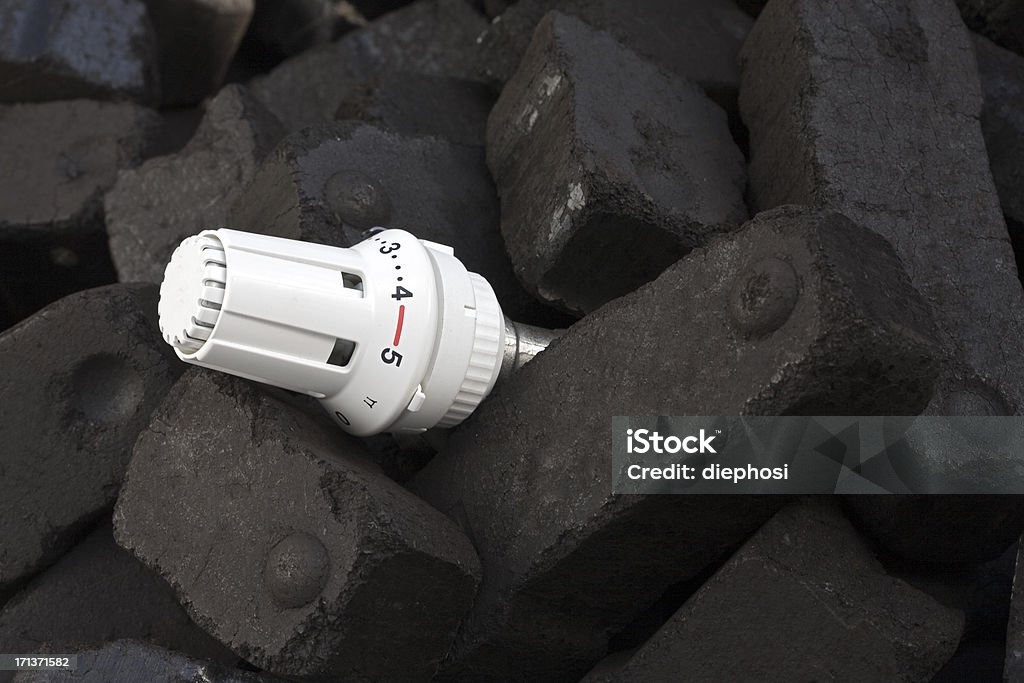 heating with coal between coals put a thermostat Heap Stock Photo