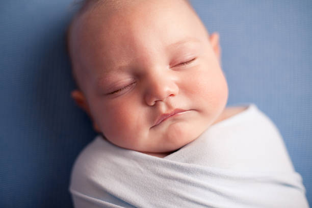 istock Close Up Image of Sleeping Baby Boy, on Blue Background 171371786