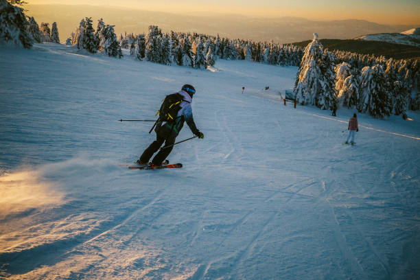 istock woman skiing in the sunset 1713720857