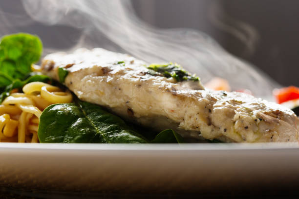 istock Steam rising from appetizing seared chicken breast, noodles and vegetables 171372751