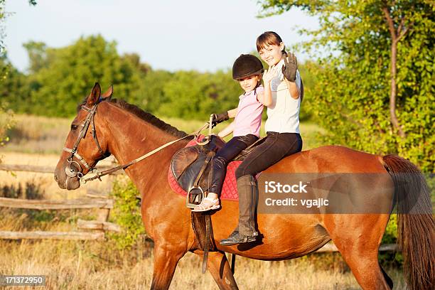 Child Riding Horse Outdoors Stock Photo - Download Image Now - A Helping Hand, Adult, Animal