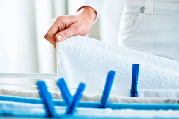 istock Woman Hanging Laundry to Dry Indoors 171373200