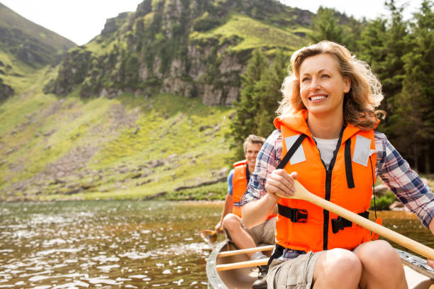 istock Happy Couple Canoeing 171373206