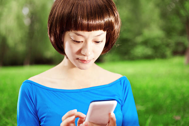 istock girl looking at her mobile phone 171373256