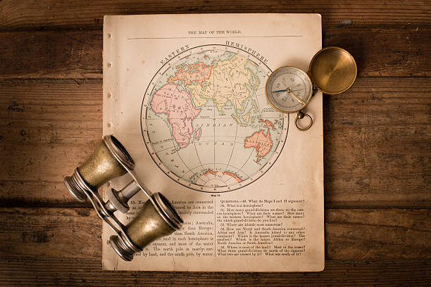 Antique 1870 Map of Eastern Hemisphere, Binoculars, and Compass "Color image of an old map of the Eastern Hemisphere, from the 1800's, with binoculars and a compass, on wood background.  Map is from an old geography book with an 1870 copyright." eastern hemisphere stock pictures, royalty-free photos & images