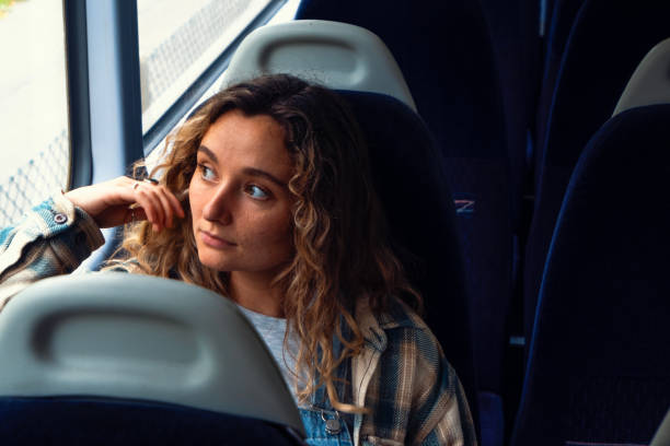 istock Young woman looking out of train window 1713735283