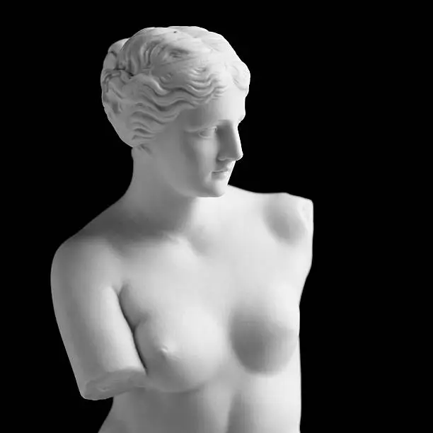 "Vintage copy statue of Venus (Aphrodite) de Milo. Vintage-styled fine art image isolated (in camera) on a pure black background. The background can easily be extended to suit your project. Soft lighting with excellent detail. A small amount of grain has been added.Venus de Milo is a famous Greek sculpture dating back to about 100 BC, discovered in 1820 on the Aegean island of Milos. The original statue is in the Louvre museum in Paris.Related images:"