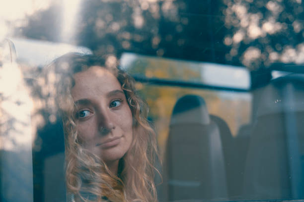istock Woman on a commuter train looks out the window. 1713736459