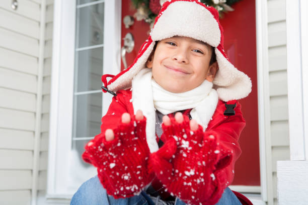 istock Christmas-Young boy playing with snow 171373949
