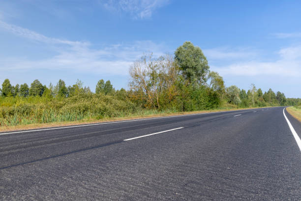 istock Narrow paved road for cars 1713743516