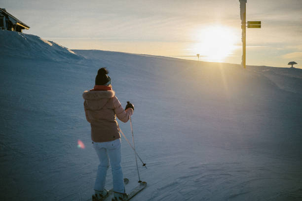 istock woman skiing in the sunset 1713743909