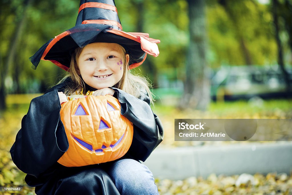 Halloween child Little girl dressed up for Halloween outdoors asking candies Child Stock Photo