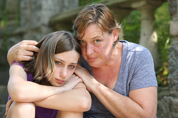 istock Child being embraced by her mother. 171374620