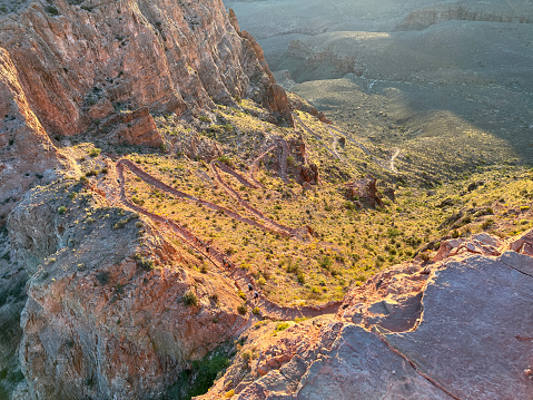Switchbacks on the South Kaibab hiking trail in the Grand Canyon at sunrise.