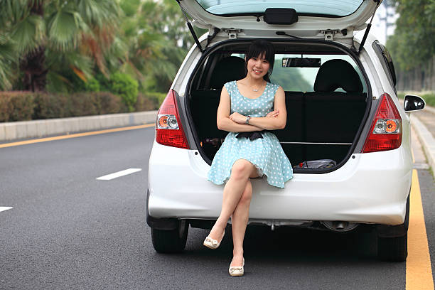 istock Yong woman with her car 171375201