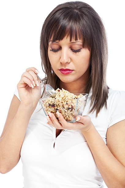 istock Young woman eating cereal breakfast 171375363