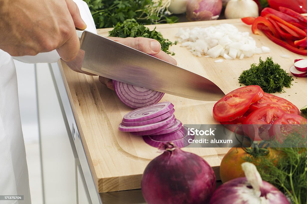 Slicing vegetables Slicing vegetables in kitchen Chef Stock Photo