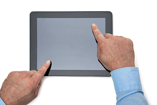 руки глядя на цифровой планшетный пк - close up touchpad computer index finger стоковые фото и изображения