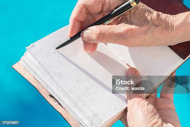Writing In Empty Leatherbook Diary Or Guestbook At Pool Stock Photo - Download Image Now