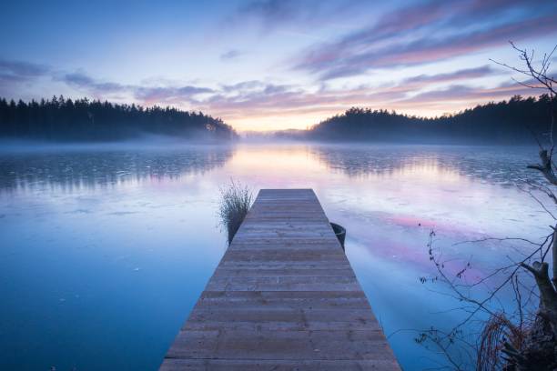 istock a boat dock that is sitting in the water by some water 1713763541