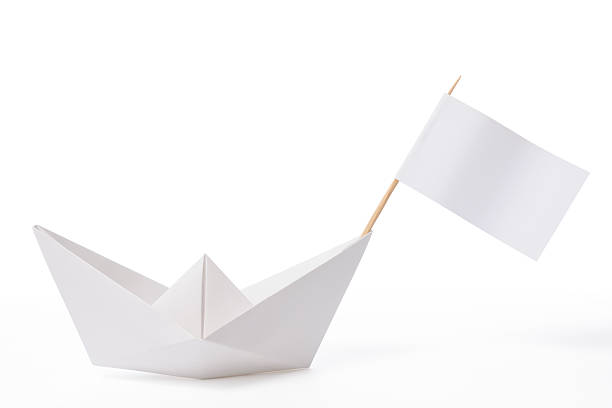 istock White paper boat with flag on white background 171377002