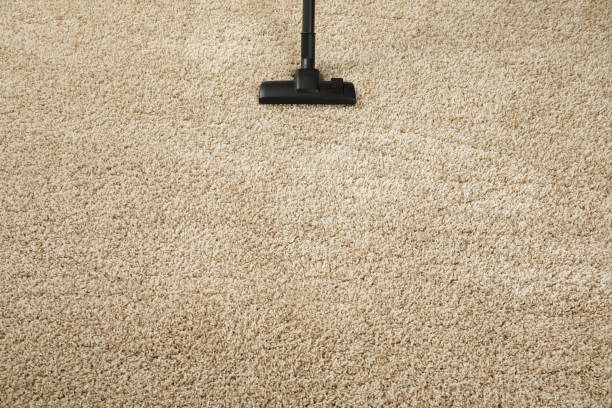 istock Removing dirt from beige carpet with modern vacuum cleaner. Space for text 1713770503