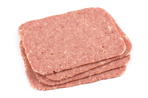 Slices of Corned Beef isolated on white.