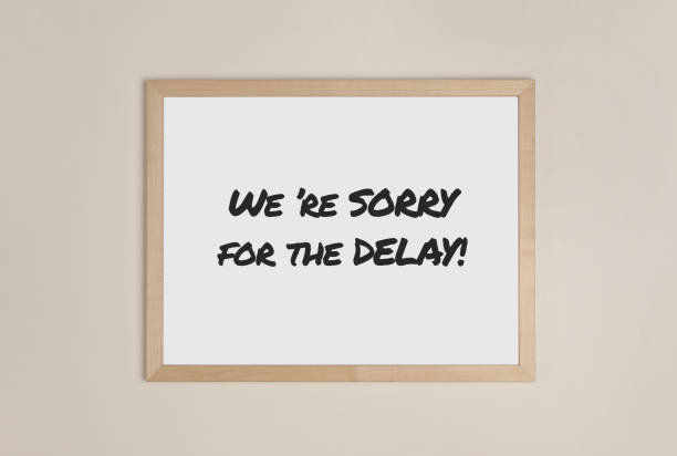 istock Frame with phrase We're Sorry For The Delay on beige wall 1713771060