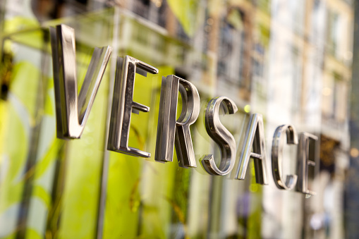 Milan, Italy - October 2, 2011: Versace store sign located in the famous fashion district of via Montenapoleone, Milan, Italy.