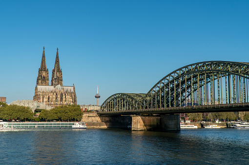 Cologne Cathedral is a famous monument of German Catholicism and Gothic architecture and a symbol of Germany.  Hohenzollern Bridge is one of the most important railway junctions in Europe