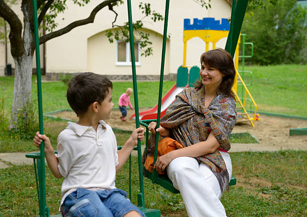 istock Mother and son on swing 171377925