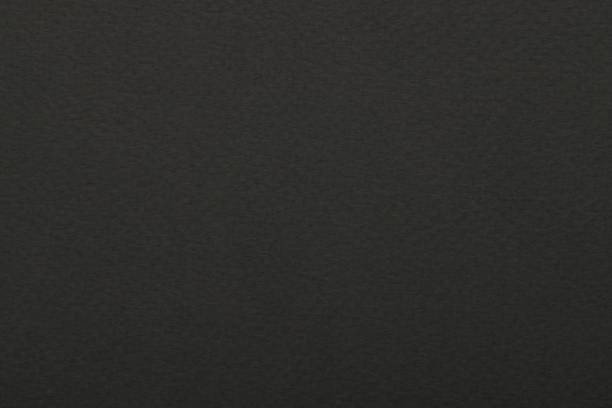 istock Texture of dark grey paper sheet as background, top view 1713780591