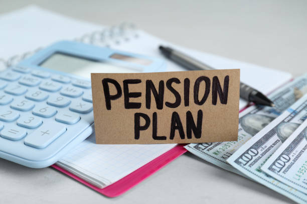 istock Card with words Pension Plan, banknotes, calculator and notebook on white table, closeup 1713780639
