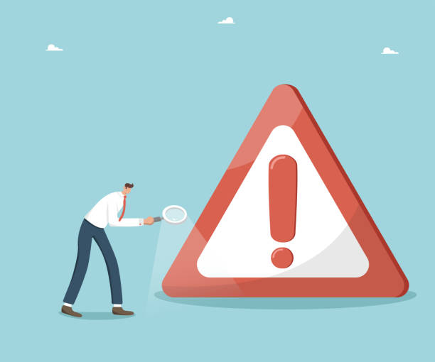 istock Man with magnifier walks near road danger sign 1713783493