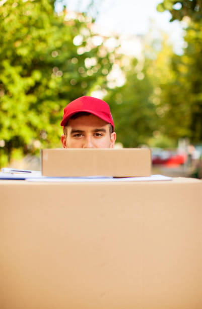 Courier delivering packages in a residential neighborhood.
