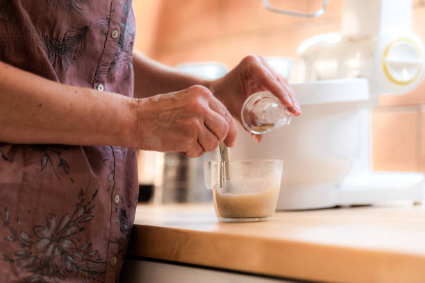 istock Woman Mixing Yeast for Making Homemade Bread 1713785794